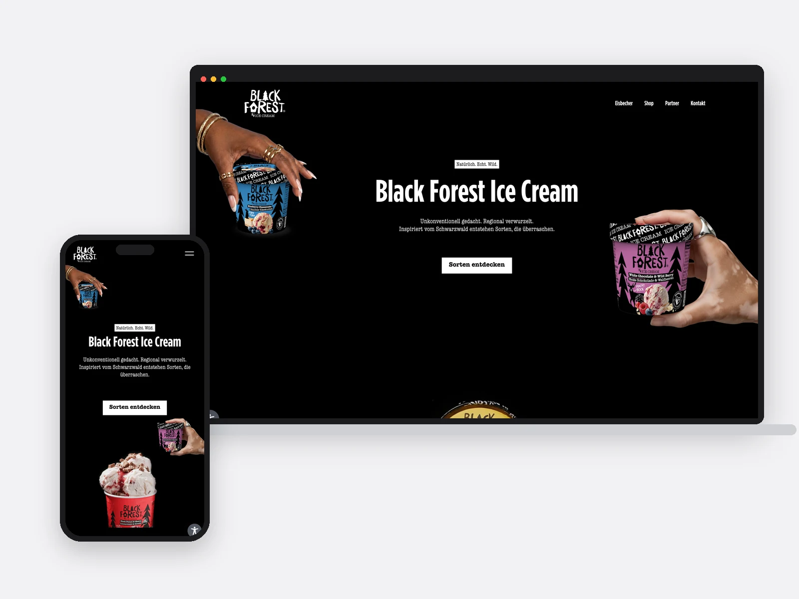 Notebook und Telefon mit der Startseite von Black Forest Ice Cream
